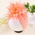Baby Turban in Pink-Orange mit großer Kamelienblüte und Strassstein-Verzierung - Blassgrün