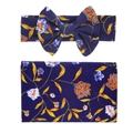 Detailed view of soft floral baby swaddle blanket and matching bow headband set in navy blue - Navy Blue Orange Floral (6)