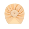Infant waffle knit turban hat with donut knot detail in a light cream pink shade - Cream