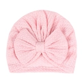 Light pink baby turban hat featuring a large bow and waffle knit texture fabric - Pink