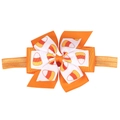 Détail du nœud en ruban gros-grain à motif candy corn sur bandeau orange souple - Bandeau / Orange