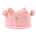 Close-up of baby pink knit crown headband with soft pom-poms and skin-friendly texture - Pink