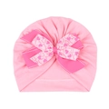 Detail of baby pink turban hat featuring a large double bow and heart pattern print - Pink (Heart)