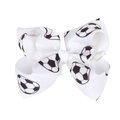 Close-up of white soccer pattern grosgrain ribbon bow with detailed fabric texture - White