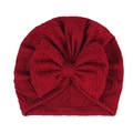 Detail of baby turban hat with large bow in dark red soft knitted fabric texture - Wine Red (Water Ripple)