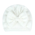 Detailed close-up of white ribbed newborn hat with a large soft bow decoration - White