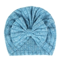Detailed close-up of blue ribbed knit baby hat with a large decorative soft bow - Blue