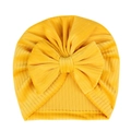Detailed close-up of yellow ribbed fabric texture and a large bow on the baby turban hat - Yellow