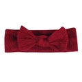 Detail shot of a dark red ribbed baby headband with a large bow on white background - Burgundy