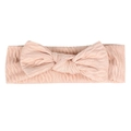 Detailed view of pink knitted baby headband with a large bow and cable knit texture - Light Coffee