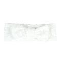 Detailed view of white baby headband with hollow texture and a large decorative bow - White