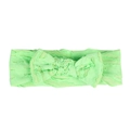 Detail of neon green baby headband featuring textured jacquard fabric and a bow knot - Green