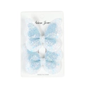 Sparkly light blue double-layered butterfly hair clips with sequins on a white display card - Blue