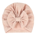 Detail view of pink baby turban hat featuring pleated texture and large bow decoration - Pearlescent Light Coffee