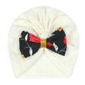 Detail of baby turban hat in cream ribbed fabric with a floral print bow decoration - Black Floral Bow (MZ111) / Off White