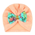 Detail of baby turban hat in peach knit cotton with a large floral bow and gold sequins - Light Green Floral Bow (MZ111) / Snow Bud