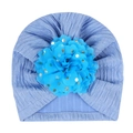 Detail of baby sky blue knit turban hat with large gold-dotted floral fabric embellishment - Blue