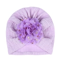 Detail of lavender baby turban hat with textured knit fabric and gold polka dot floral - Purple