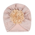 Detailed texture of pink baby turban hat featuring a large gold foil polka dot mesh flower - Light Coffee