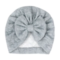Detailed close-up of grey baby turban hat featuring a large bow and soft knit fabric texture - Gray
