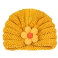 Detailed texture of yellow knit baby turban hat featuring a 3D fabric flower accent - Yellow