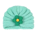 Detail of mint green cable-knit baby hat with decorative five-petal fabric flower - Turquoise Blue