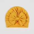 Dettaglio del cappello turbante giallo neonato con grande fiocco e trama in maglia - Giallo