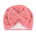 Detail shot of the pink popcorn textured fabric and large bow on this warm baby turban hat - Dust Rose