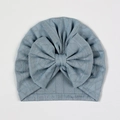 Detail view of light blue baby turban featuring a large bow and diamond mesh knit texture - Navy Blue