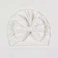 Close-up of white newborn baby hat with hollow geometric diamond knit texture and bow - White