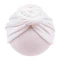 Detailed view of white baby turban with hand-knitted knot design and soft fabric texture - White