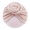 Macro shot of knitted infant turban with donut knot in soft apricot beige fabric - Light Coffee
