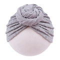 Close-up of light gray knitted infant turban hat with decorative top knot detail - Gray