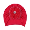 Detailed view of red knitted baby turban hat with large tulle flower and crystal center - Red Hat
