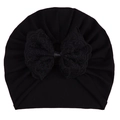 Black knitted baby turban hat featuring a large elegant lace bow decoration - Black Hat