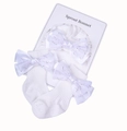 Weißes Set aus Baby-Stirnband und Socken mit Pailletten-Schleifen auf Karton - Mütze Und Socken / Weiß