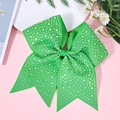 Close-up of green rhinestone bow hair clip with high-density ribbon and sparkling crystals - Green