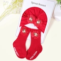 Detail of red cotton baby turban hat and socks set featuring delicate fabric flower accents - Red Bouquet