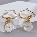 Gold 14K stainless steel sunflower earrings with white shell disc charms on stone - Mother of Pearl Disc Style (SFLE593)