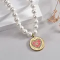 Collana di perle stile francese con ciondolo a cuore dorato e cristalli luminosi - Cuore Rosa