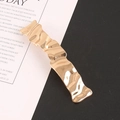 Elegant gold alloy hair clip with irregular ripple texture on minimalist black-white background - Gold