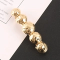 Golden hammer-textured ball hair clip featuring five spherical alloy design elements - Gold