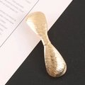Fermaglio per capelli in metallo dorato spazzolato con design a fiocco astratto - Oro