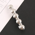 Close-up of a silver polished metal hair clip featuring five spherical beads in a row - Silver