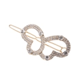 Golden wavy hair clip with hollow rhinestone butterfly design on white background - Zirconia Style / Gold