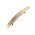 Golden hammered texture metal hair clip with curved minimalist design on white background - Gold