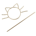 Detail of golden hollow cat hair slide with textured metal surface and matching hairpin - Gold