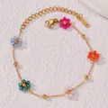 Bracciale in acciaio inossidabile dorato con cinque ciondoli a fiore in cristallo - Bracciale Piccoli Fiori