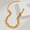 Détail d'un bracelet double couche plaqué or 18 carats avec charmes éclair en zircon brillant - Chaîne Multicouche Éclair en Strass (SFLB1031)