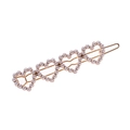 Elegante fermaglio in metallo dorato con cinque cuori cavi e perle bianche - Oro
